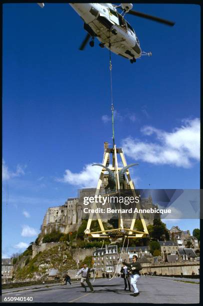 The statue of the archangel Saint-Michael will be restored in beaten copper, gilded with gold leaf. | Location: Mont-St.-Michael, France.