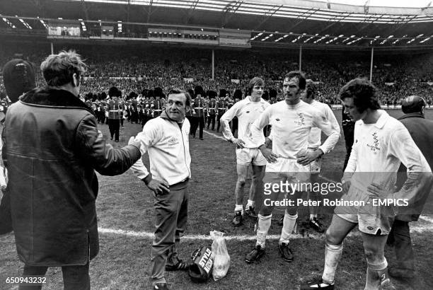 Leeds United manager Don Revie tries to console trainer Les Cocker and players Allan Clarke, Paul Madeley, Mick Jones and Trevor Cherry after their...