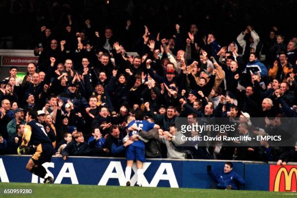 Chelsea's Gianfranco Zola celebrates opening the scoring against Peterborough United with Chelsea fans