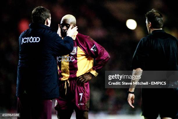 The Bradford City physiotherapist checks to see if Jamie Lawrence's contact lenses are colour co-ordinated with his hair