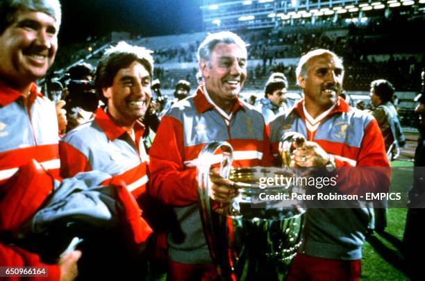 The Liverpool coaching team of Chris Lawler, Roy Evans, manager Joe Fagan and Ronnie Moran celebrate with the European Cup
