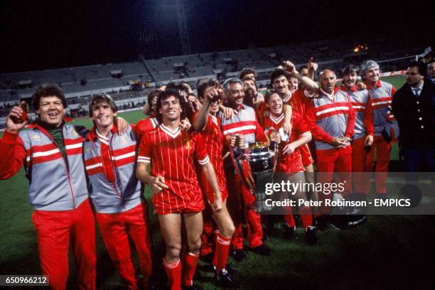 The Liverpool team and coaching staff celebrate winning the European Cup for the fourth time: Bob Bolder, Kenny Dalglish, Craig Johnston, Mark...