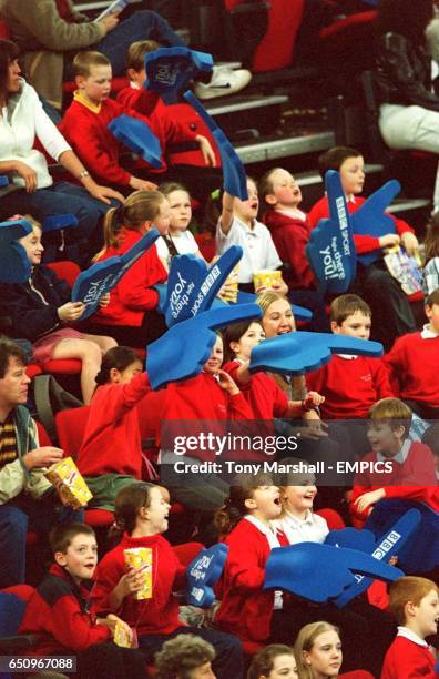 Schoolchildren wave their BBC Sport foam hands with much vigour