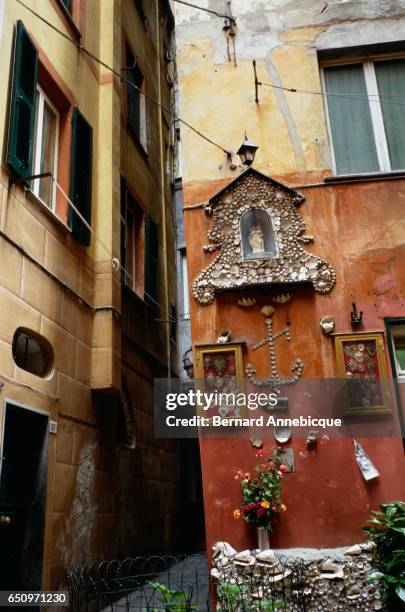 Shrine off an alley in Camogli is decorated with sea shells.