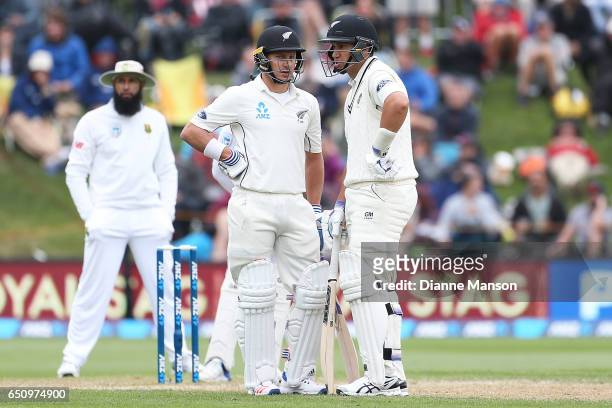 Neil Wagner and Ross Taylor of New Zealand bat during day three of the First Test match between New Zealand and South Africa at University Oval on...