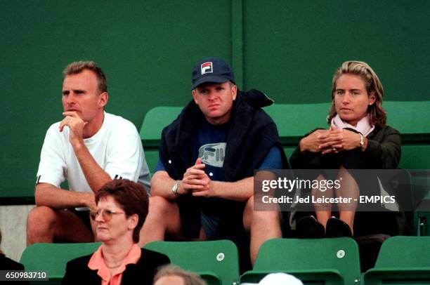 Tim Henman's Coach David Felgate and girlfriend Lucy Heald look on as he crashes out of the Nottingham Open in the First Round