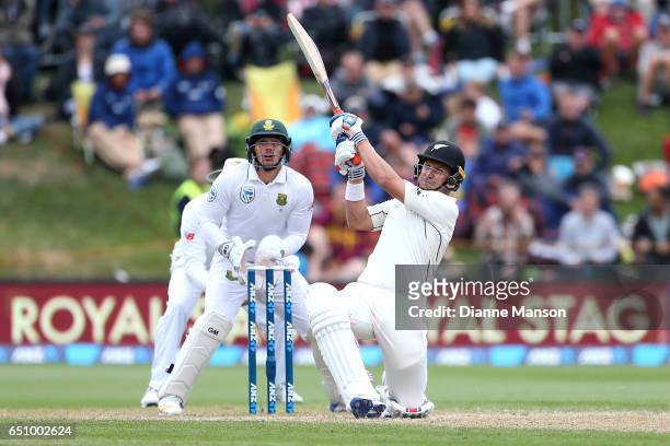 Neil Wagner of New Zealand hits a boundary during day three of the First Test match between New Zealand and South Africa at University Oval on March...