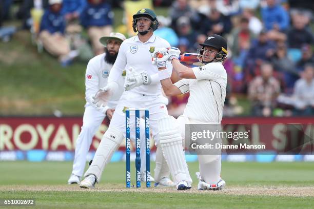 Neil Wagner of New Zealand hits a boundary during day three of the First Test match between New Zealand and South Africa at University Oval on March...