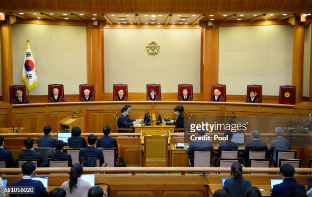 South Korean acting Constitutional Court's Chief Judge Lee Jung-mi and seven judges during final ruling of President Park Geun-hye's impeachment at...
