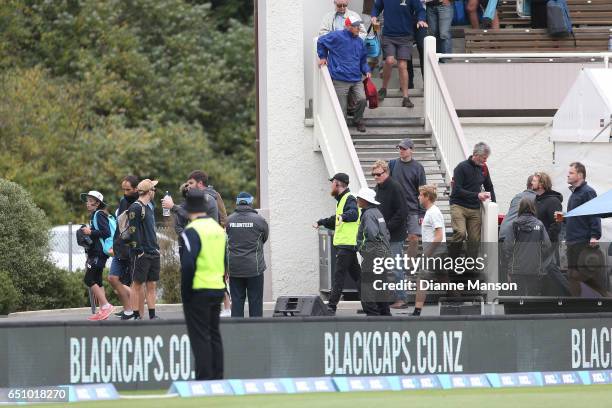 Full field evacuation during day three of the First Test match between New Zealand and South Africa at University Oval on March 10, 2017 in Dunedin,...