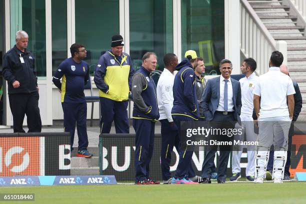 Players and team management leave due to a full field evacuation during day three of the First Test match between New Zealand and South Africa at...