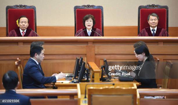 South Korean acting Constitutional Court's Chief Judge Lee Jung-mi speaks during the final ruling of South Korean President Park Geun-hye's...