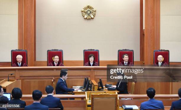 South Korean acting Constitutional Court's Chief Judge Lee Jung-mi speaks during the final ruling of South Korean President Park Geun-hye's...