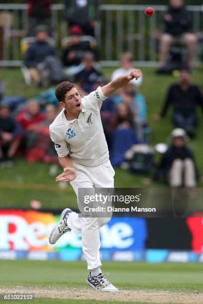 Mitchell Santner of New Zealand bowls during day three of the First Test match between New Zealand and South Africa at University Oval on March 10,...