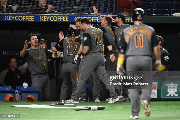 Australian players celebrate after a RBI single by Infielder Logan Wade of Australia to make it 1-0 in the top of the fifth inning during the World...