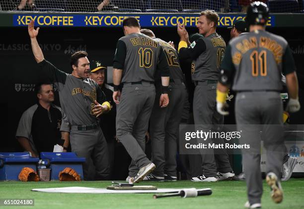 Australian players celebrate after a RBI single by Infielder Logan Wade of Australia to make it 1-0 in the top of the fifth inning during the World...