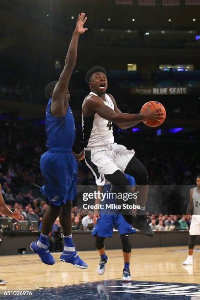 Maliek White of the Providence Friars drive to the basket against the Creighton Bluejays during the Big East Basketball Tournament - Quarterfinals at...