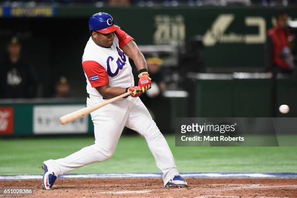 Outfielder Alfredo Despaigne of Cuba hits a grand slam to make it 1-4 in the bottom of the fifth inning during the World Baseball Classic Pool B Game...