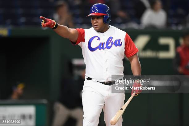 Outfielder Alfredo Despaigne of Cuba celebrates after hitting a grand slam to make it 1-4 in the bottom of the fifth inning during the World Baseball...