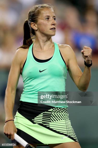 Annika Beck of Germany celebrates a point against Eugenie Bouchard of Canada during the BNP Paribas Open at the Indian Wells Tennis Garden on March...