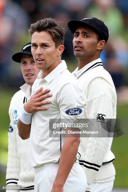 Trent Boult, and Jeet Raval of New Zealand look on during day three of the First Test match between New Zealand and South Africa at University Oval...