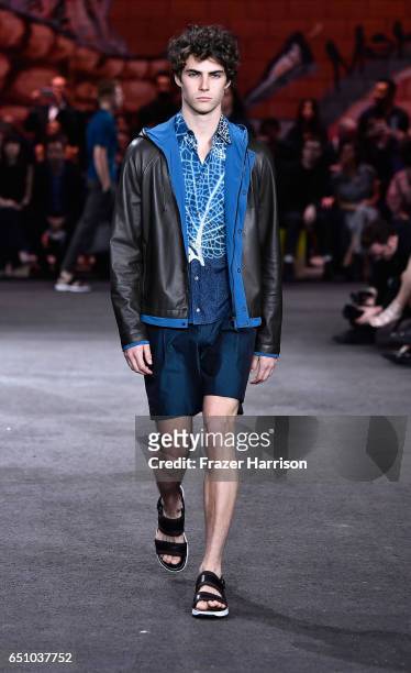 Model walks the runway at the Hermes: Dwtwn Men - s/s17 Runway Show on March 9, 2017 in Los Angeles, California.