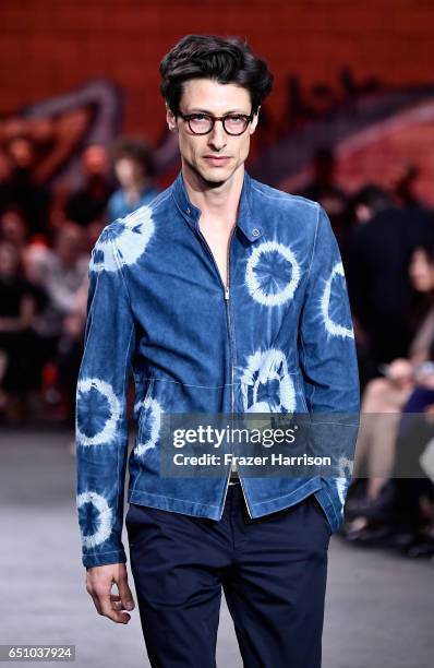 Model walks the runway at the Hermes: Dwtwn Men - s/s17 Runway Show on March 9, 2017 in Los Angeles, California.