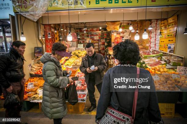 Jeon Tae-san, a fruit seller said "the economy was bad, but the whole society will become stable from today" an hour after the impeachment ruling on...