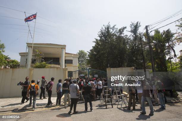 Malaysian activists hold a banner during a gathering urging Malaysia and North Korea to come up with a peaceful solution to the current diplomatic...