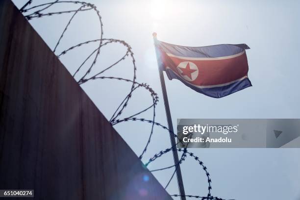 Malaysian activists hold a banner during a gathering urging Malaysia and North Korea to come up with a peaceful solution to the current diplomatic...