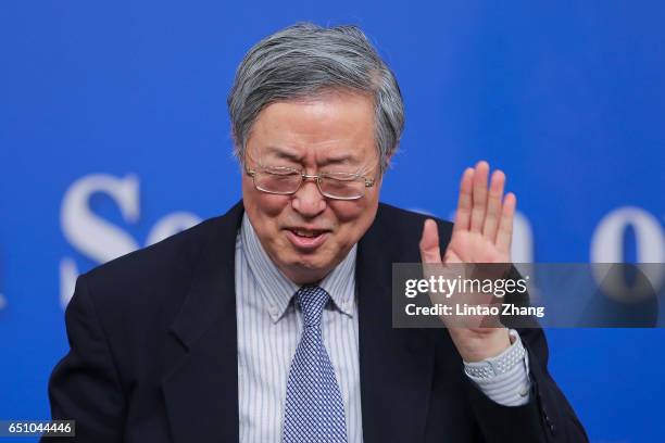 Zhou Xiaochuan, governor of the People's Bank of China, attends a press conference at the media center on March 10, 2017 in Beijing, China. Zhou...