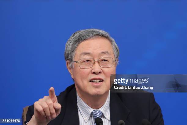 Zhou Xiaochuan, governor of the People's Bank of China, speaks during a press conference at the media center on March 10, 2017 in Beijing, China....