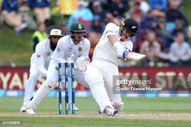 Neil Wagner hits to the boundary during day three of the First Test match between New Zealand and South Africa at University Oval on March 10, 2017...