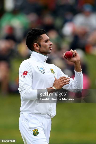 Keshav Maharaj of South Africa bowls during day three of the First Test match between New Zealand and South Africa at University Oval on March 10,...