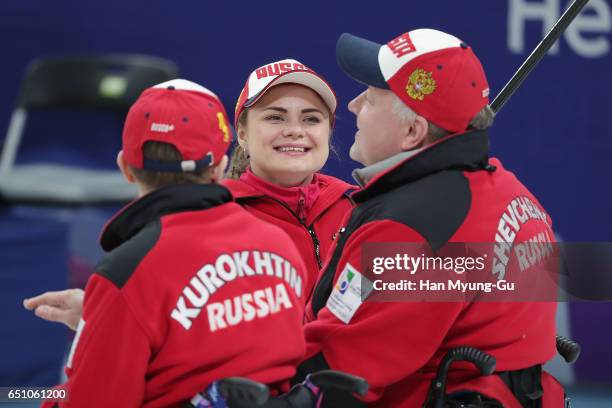 Daria Shchukina, Alexander Shevchenko and Konstantin Kurokhtin from Russia react during the World Wheelchair Curling Championship 2017 - test event...