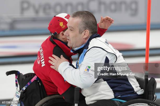 Konstantin Kurokhtin from Russia shakes hands with Robert McPherson from Scotland the World Wheelchair Curling Championship 2017 - test event for...