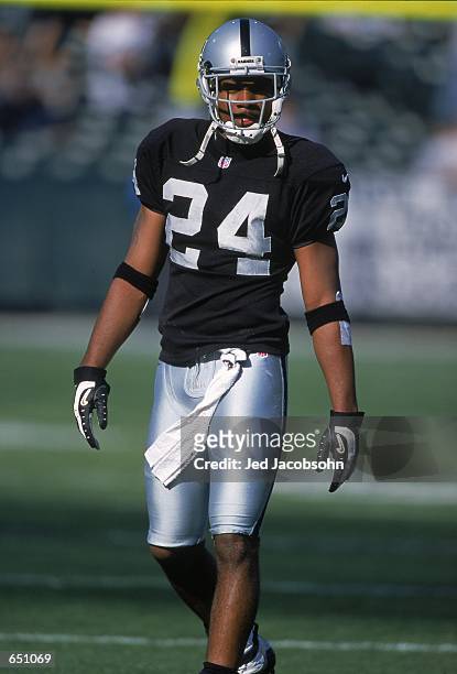 Charles Woodson of the Oakland Raiders looks on from the field during the game against the Atlanta Falcons at the Network Associates Coliseum in...