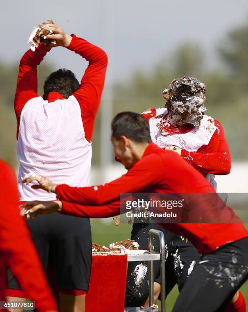 Teammates of Samuel Eto'o of Antalyaspor throw birthday cake during his birthday celebration after a training session in Antalya, Turkey on March 10,...