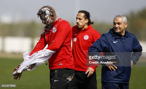Teammates of Samuel Eto'o of Antalyaspor throw birthday cake during his birthday celebration after a training session in Antalya, Turkey on March 10,...
