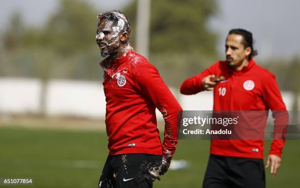 Teammates of Samuel Eto'o of Antalyaspor throw birthday cake during his birthday celebration after a training session in Antalya, Turkey on March 10,...