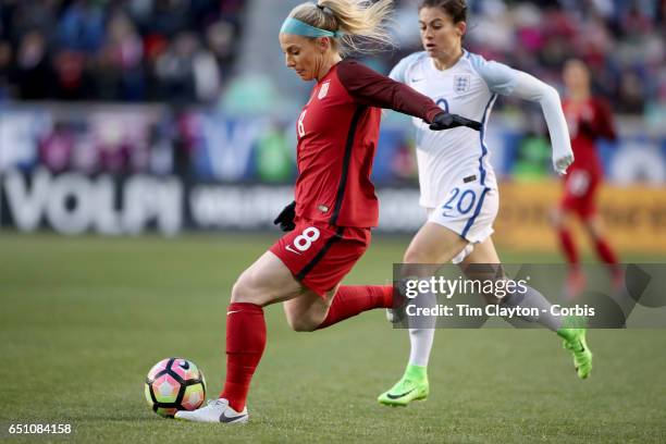 Julie Johnston of United States is challenged by Karen Carney of England during the USA Vs England SheBelieves Cup match at Red Bull Arena on March...