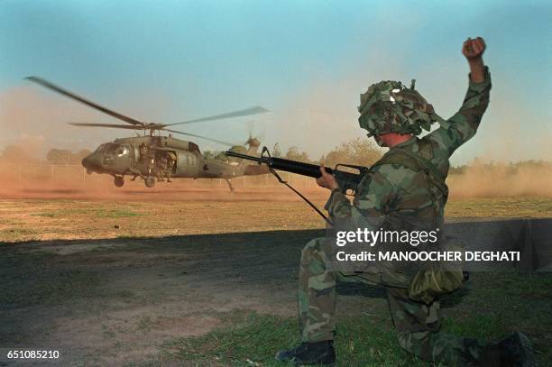 Soldiers guides a military helicopter during an operation against a military command post loyal to General Manuel Noriega, on December 23, 1989 in...