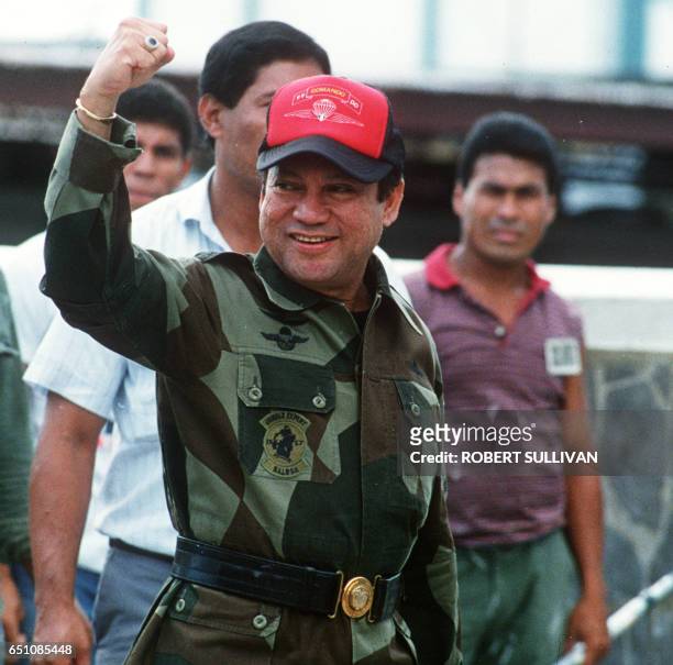 Photo taken 04 October 1989 shows former Panamanian strongman General Manuel Noriega waving as he left his headquarters in Panama City following a...