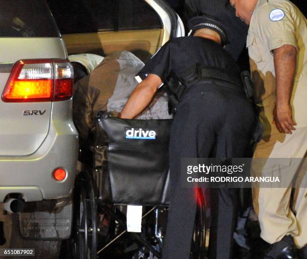 Person supposed to be Panama's former dictator Manuel Noriega is carried on a wheelchair upon arrival at Renacer prison, 25 km south east of Panama...