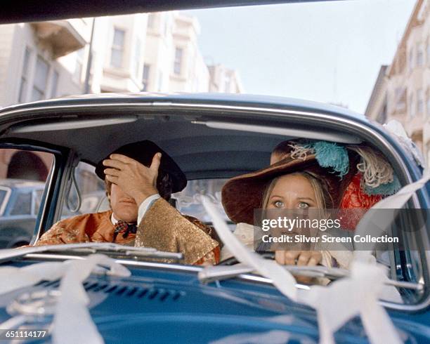 Actress and singer Barbra Streisand with actor Ryan O'Neal in the screwball comedy 'What's Up, Doc?', 1972.