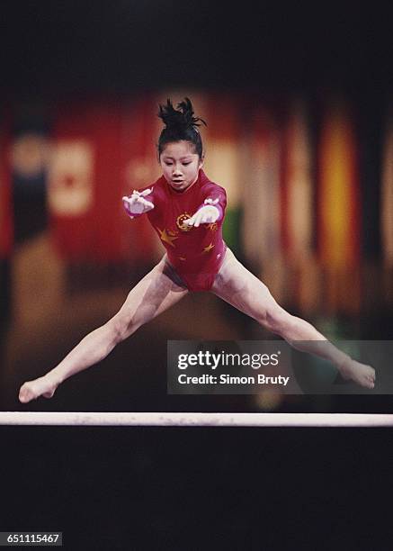 Lu Li of China performs during the Women's Uneven Bars event on 1 October 1992 during the World Artistic Gymnastics Championships at the Palais...