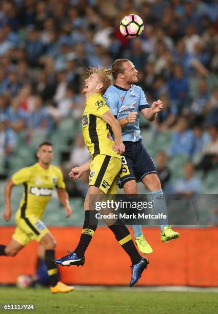 Josh Bingham of the Mariners and Rhyan Grant of Sydney FC compete for the ball during the round 23 A-League match between Sydney FC and the Central...