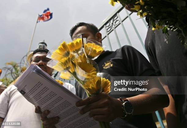 Solidarity Ajak Muda Malaysia send a yellow daisy flowers as a symbol of friendships between Malaysia and North Korea in front of the North Korea...