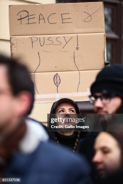 Woman with a banner participates in the Miedzynarodowy Strajk Kobiet on March 08, 2017 in Warsaw, Poland. IWS is an initiative established by womens...