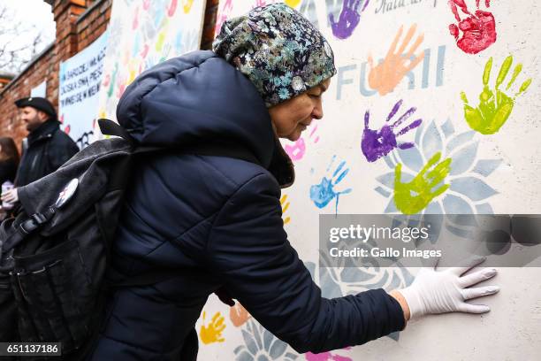 Woman with paint on the glove participates in the Miedzynarodowy Strajk Kobiet on March 08, 2017 in Warsaw, Poland. IWS is an initiative established...